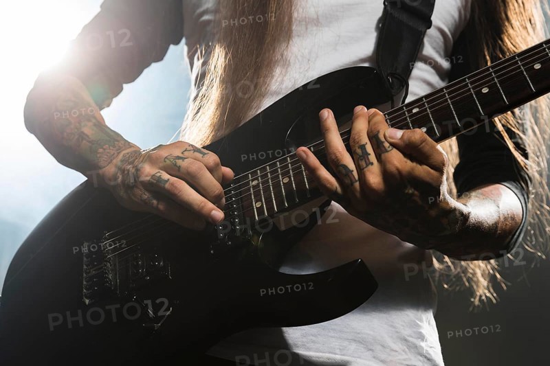 Artist playing electric guitar