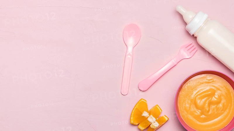 Top view baby food with baby bottle copy space