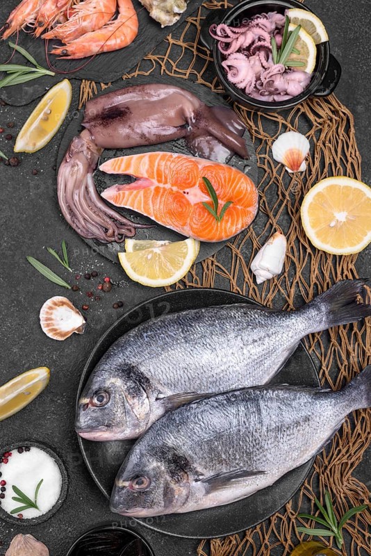 Fresh uncooked seafood fish various plates