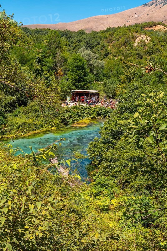 Tourists visiting The Blue eye or Syri i kalter