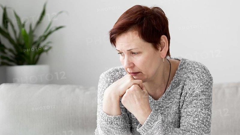 Front view woman with anxiety couch