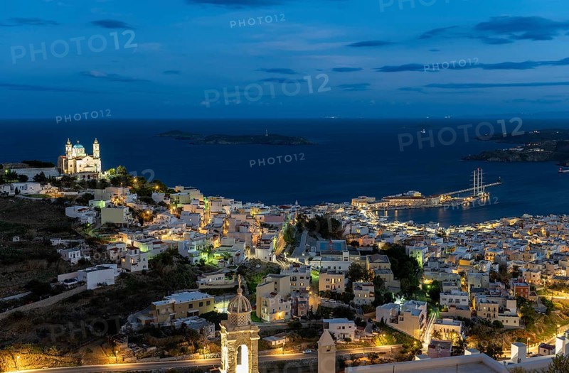 View of the illuminated town of Ermoupoli with Anastasi Church or Church of the Resurrection