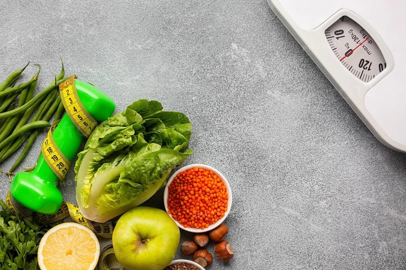 Scale with groceries gray background