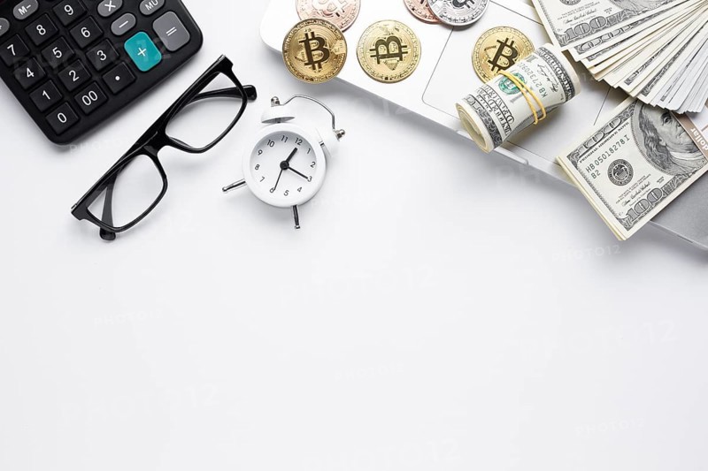 Top view coins paper money laptop