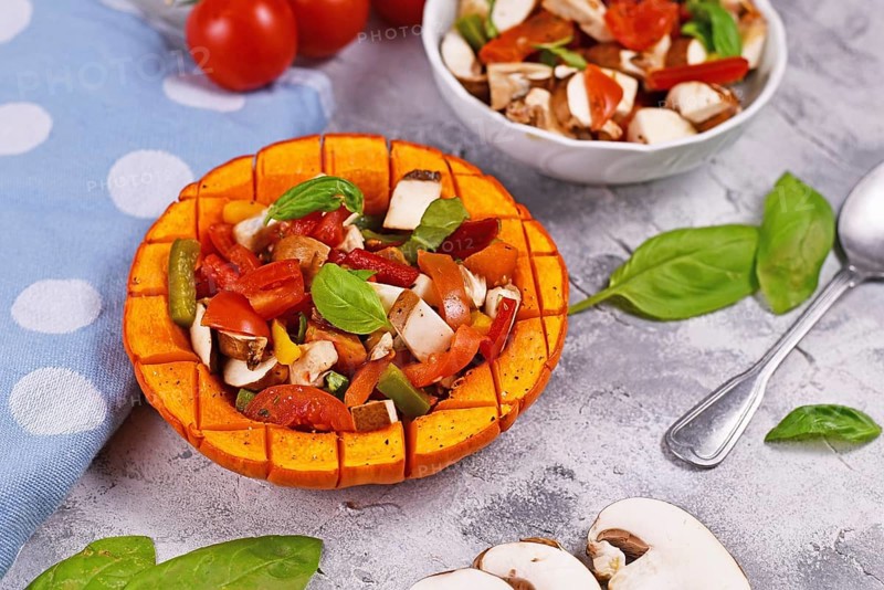 Vegan baked Red kuri squash vegetable filled with bell pepper