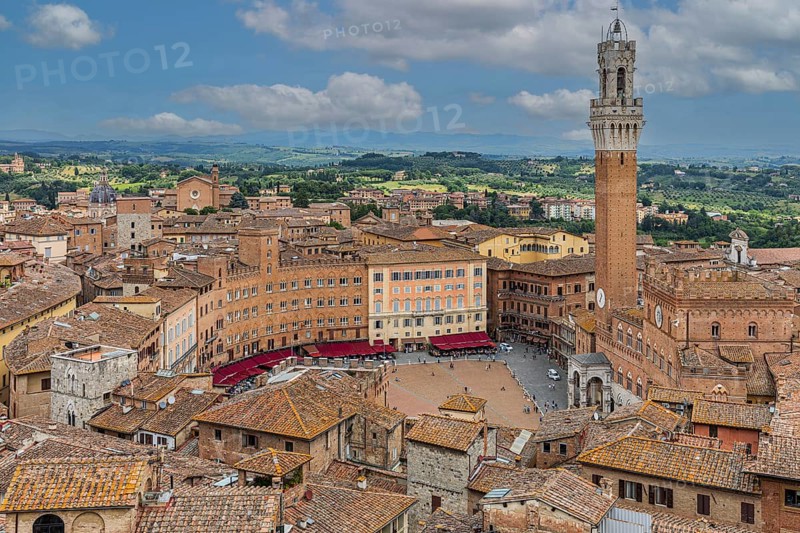 Above the rooftops of Siena with a view of the Torre del Mangia bell tower and Piazza del Campo