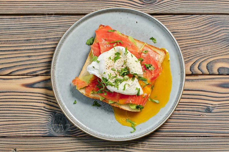 Top view of sandwich with salmon and poached egg