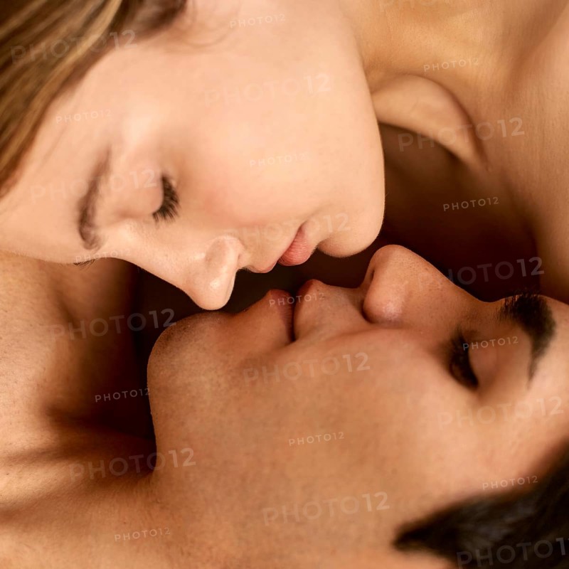 Close up shirtless man woman almost kissing
