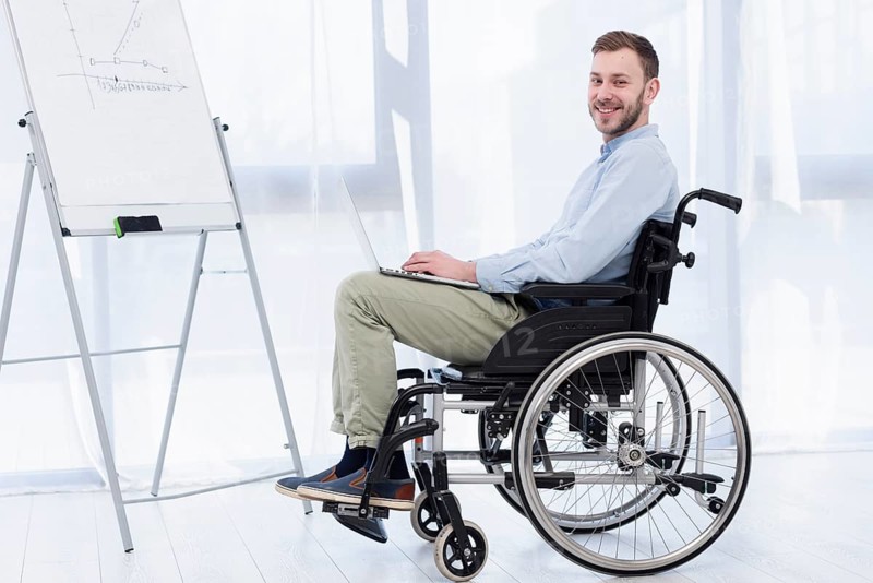 Side view man wheelchair