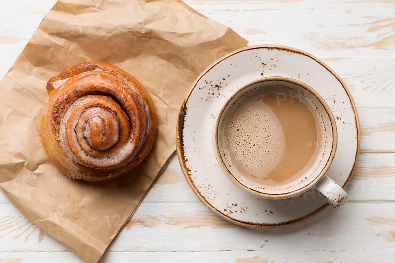 Top view breakfast assortment with coffee pastry