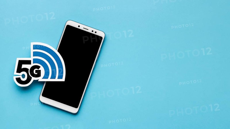 Top view smartphone with 5g symbol copy space