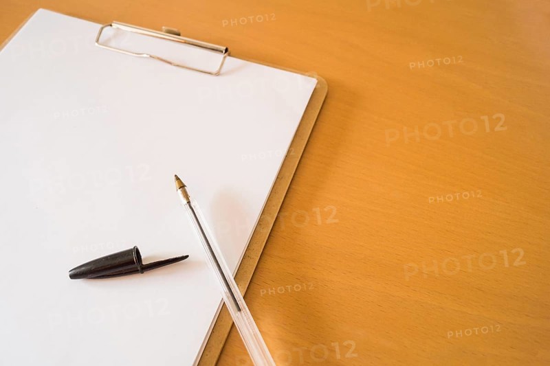 Ball pen clipboard with papers