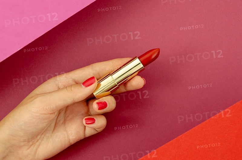 Top view woman holding red lipstick