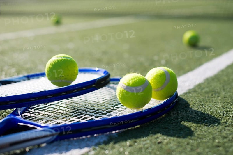 Close up tennis rackets balls ground