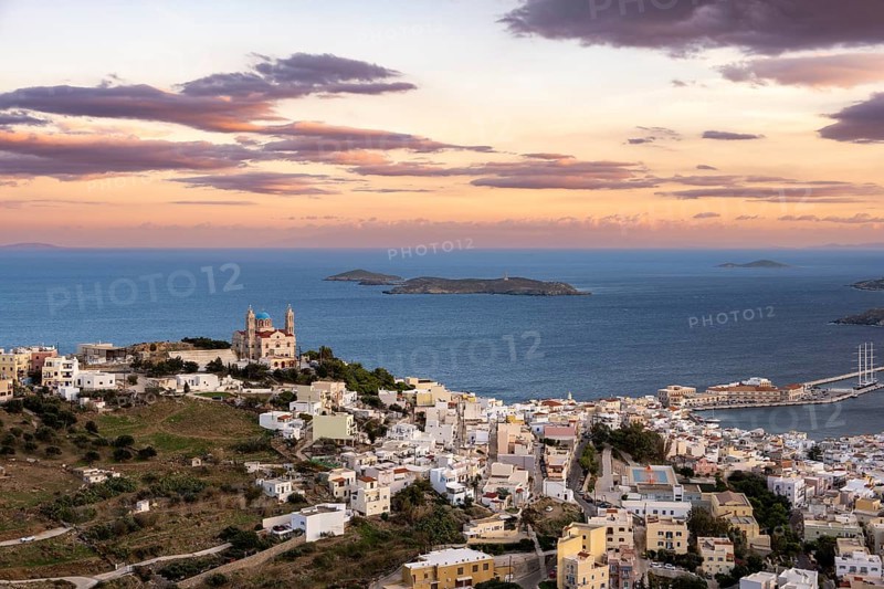 View of the town of Ermoupoli with Anastasi Church or Church of the Resurrection at sunset
