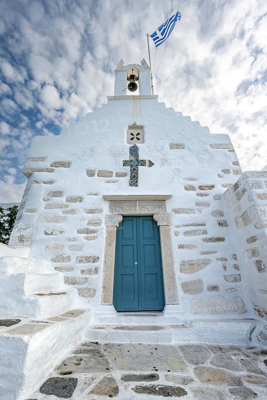 White Greek Orthodox Church Holy Church of Agios Konstantinos with Greek flag
