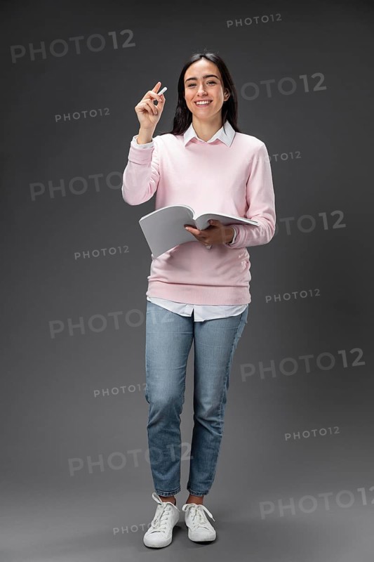 Portrait teacher female holding book