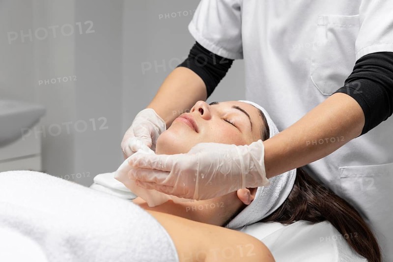 Young woman having facial skincare treatment