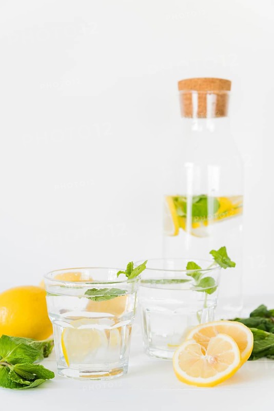Glasses bottle with lemon mint drink