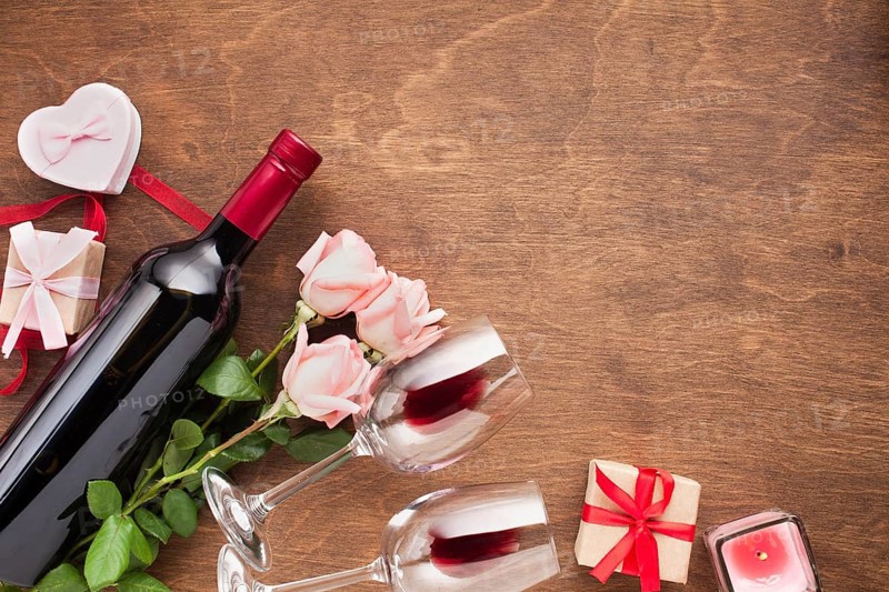 Top view assortment with roses wine