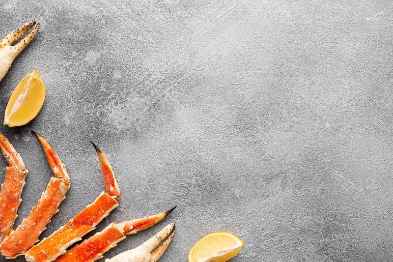 Top view lobster with lemons copy space