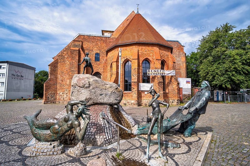 Market fountain in front of ruined St Mary's parish church