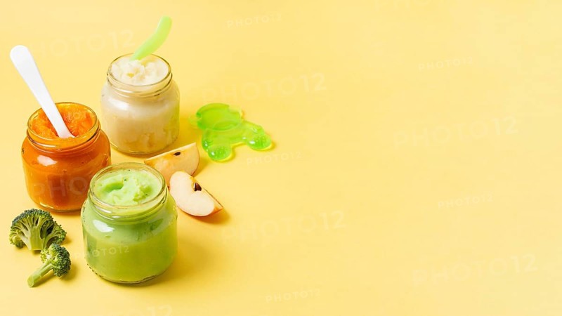 Baby food frame jars yellow background