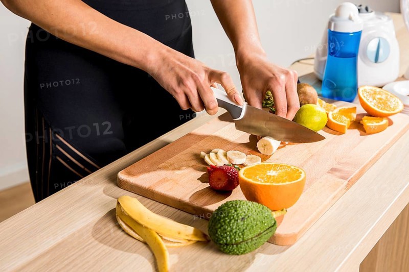 Fitness woman preparing detox juice
