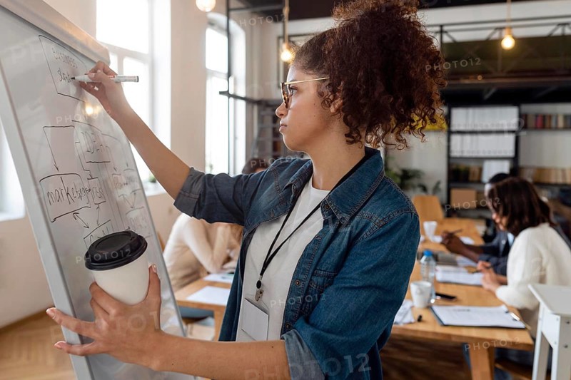 Medium shot woman writing board