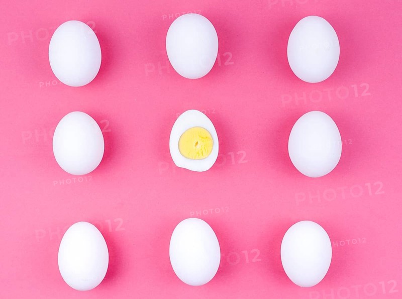 White chicken eggs with boiled egg table
