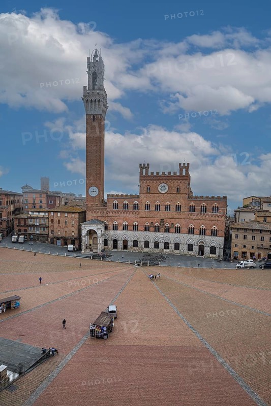 Piazza del Campo at dawn with the bell tower Torre del Mangia and the town hall Palazzo Pubblico