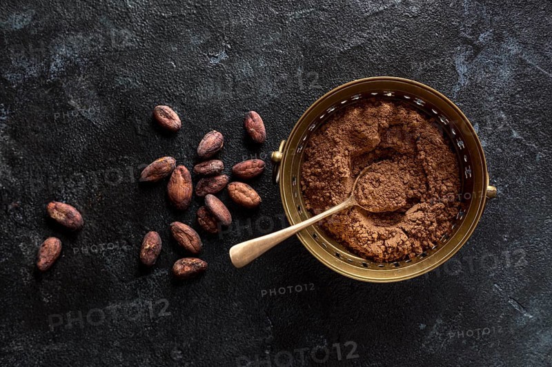 Top view bowl with cocoa powder cocoa beans