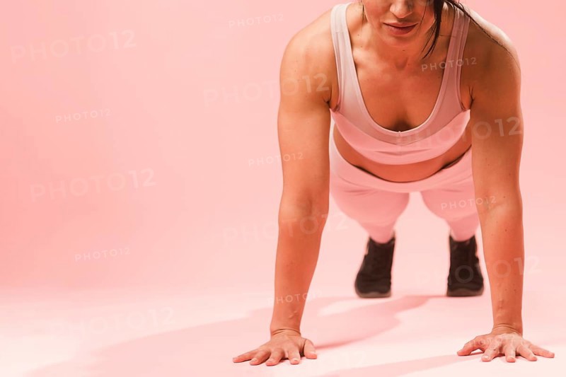 Athletic woman doing push up
