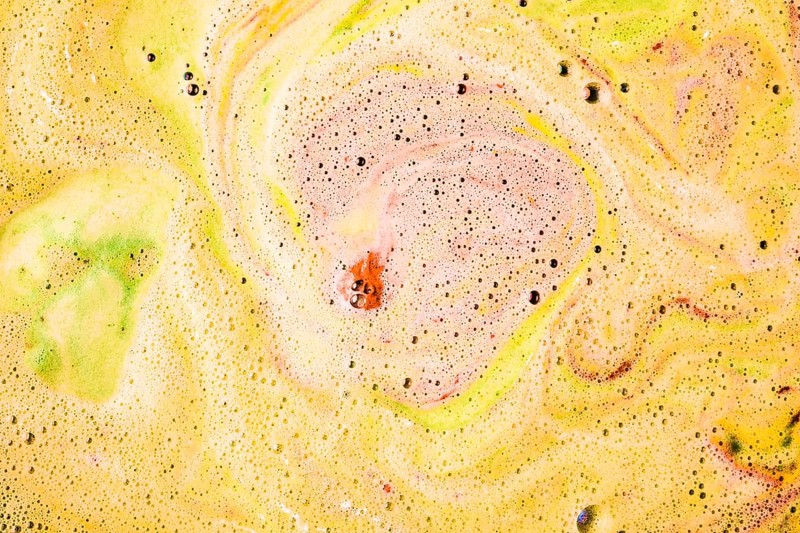 Foam bubbles form surface bath bomb dissolve water