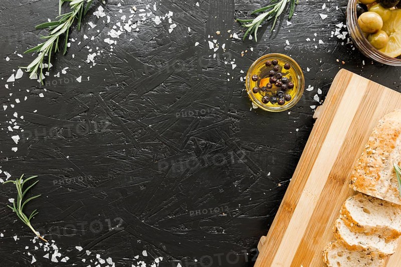 Table with cutting board bread with oil