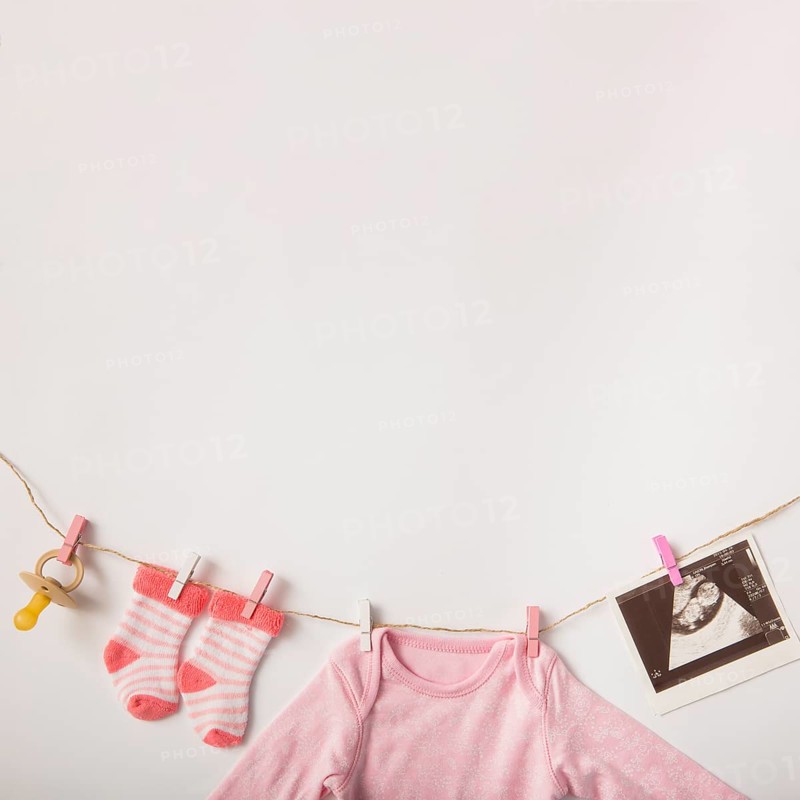 Pacifier sonography picture socks baby clothing hanging clothesline white background
