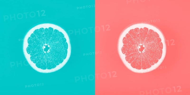 Contrast blue coral backdrop with grapefruit slice
