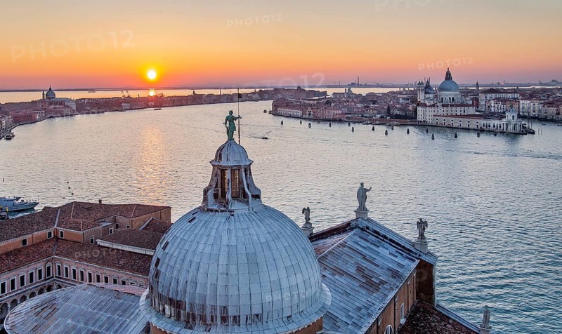 Sunset over the Giudecca Canal with the churches of San Giorgio Maggiore and Santa Maria della Salute