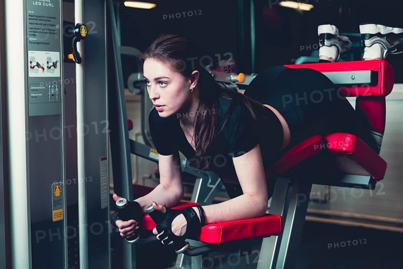 Sporty woman doing fitness exercise gym