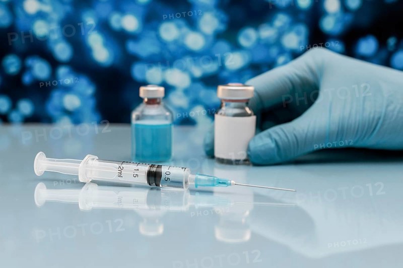 Syringe vaccine bottle table with hand glove