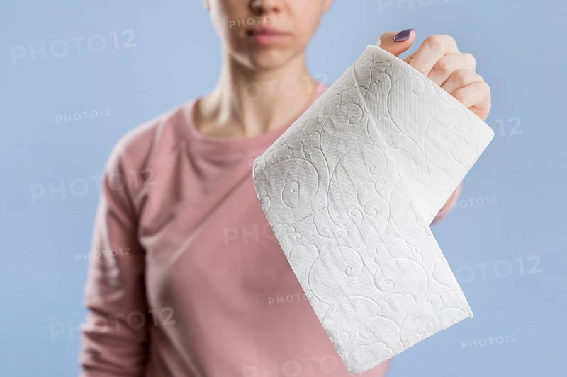 Front view woman holding toilet paper roll