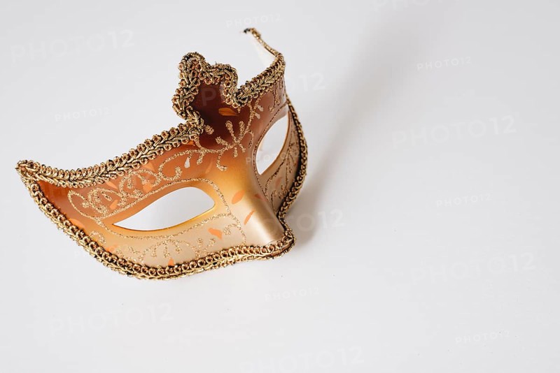 Orange carnival mask light table