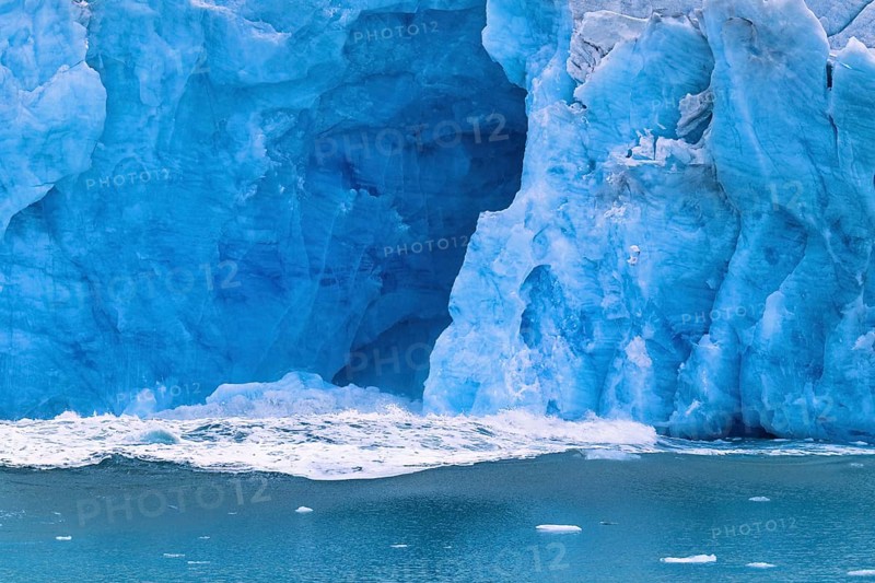 Water wave after a calving glacier in the sea