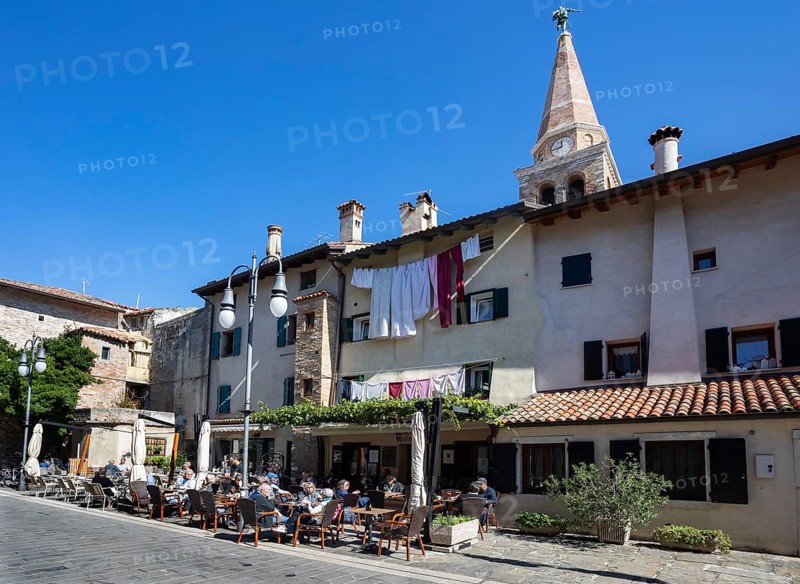 Restaurant in the old town with the Basilica of Sant Eufemia