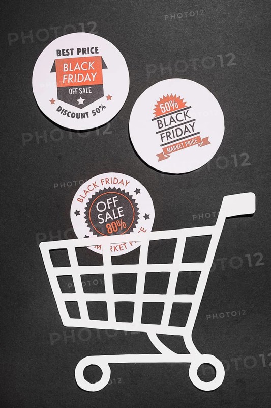 Labels with black friday offers paper shopping cart