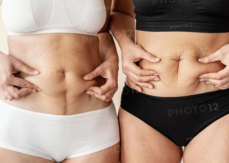 Close up women holding belly
