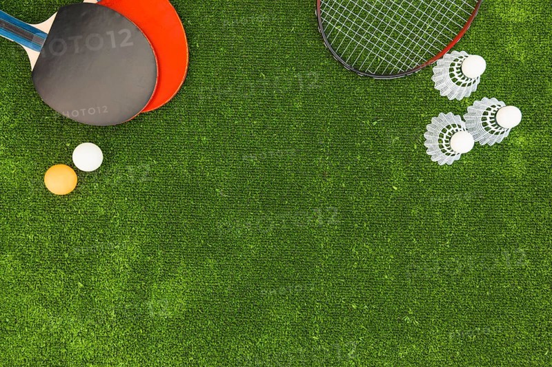 Ping pong balls shuttlecock badminton rackets green turf