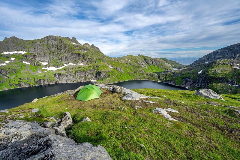 Green tent in the mountains