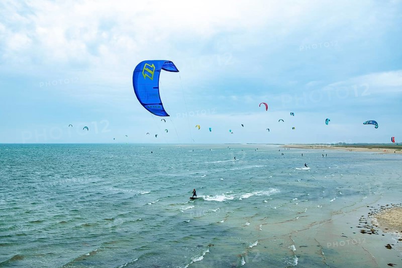 Kite surfers on the green beach of Terschelling