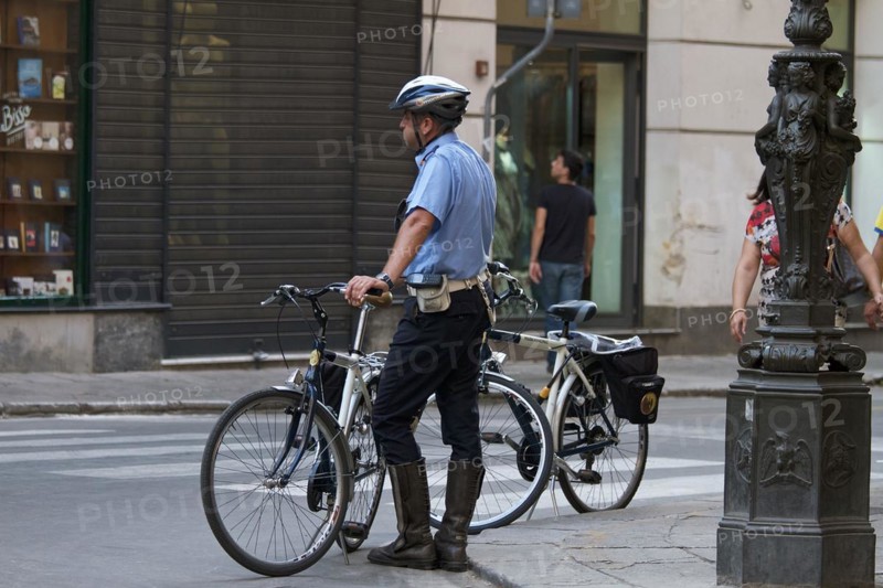 Policeman next to bicycle